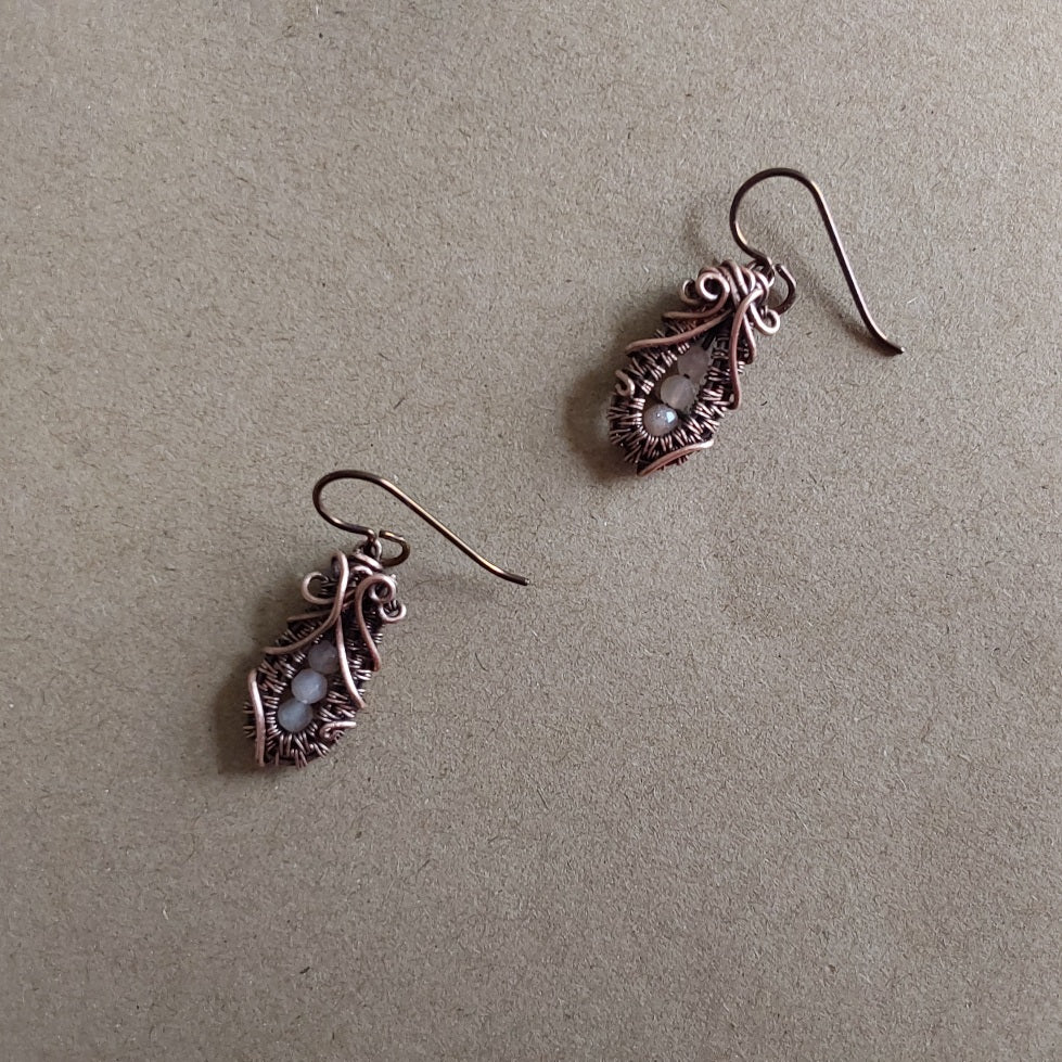 Faceted Peach Moonstone 'Ballet Shoe' style earrings with hypoallergenic ear wires. The wire weave component of each earring is approximately 1/2 an inch (2cm) in length plus ear wire length of 2 cm.