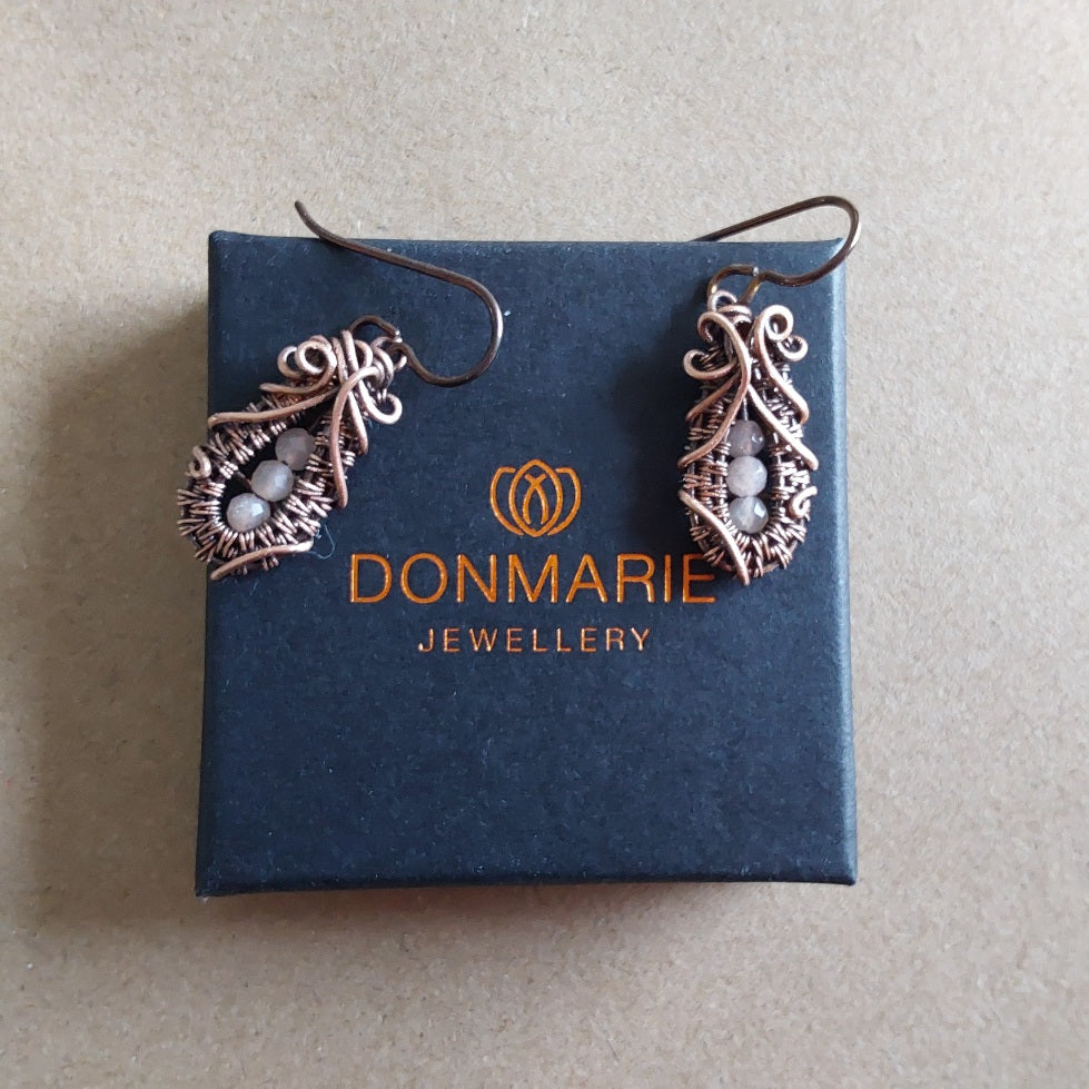 Faceted Peach Moonstone 'Ballet Shoe' style earrings with hypoallergenic ear wires. The wire weave component of each earring is approximately 1/2 an inch (2cm) in length plus ear wire length of 2 cm.