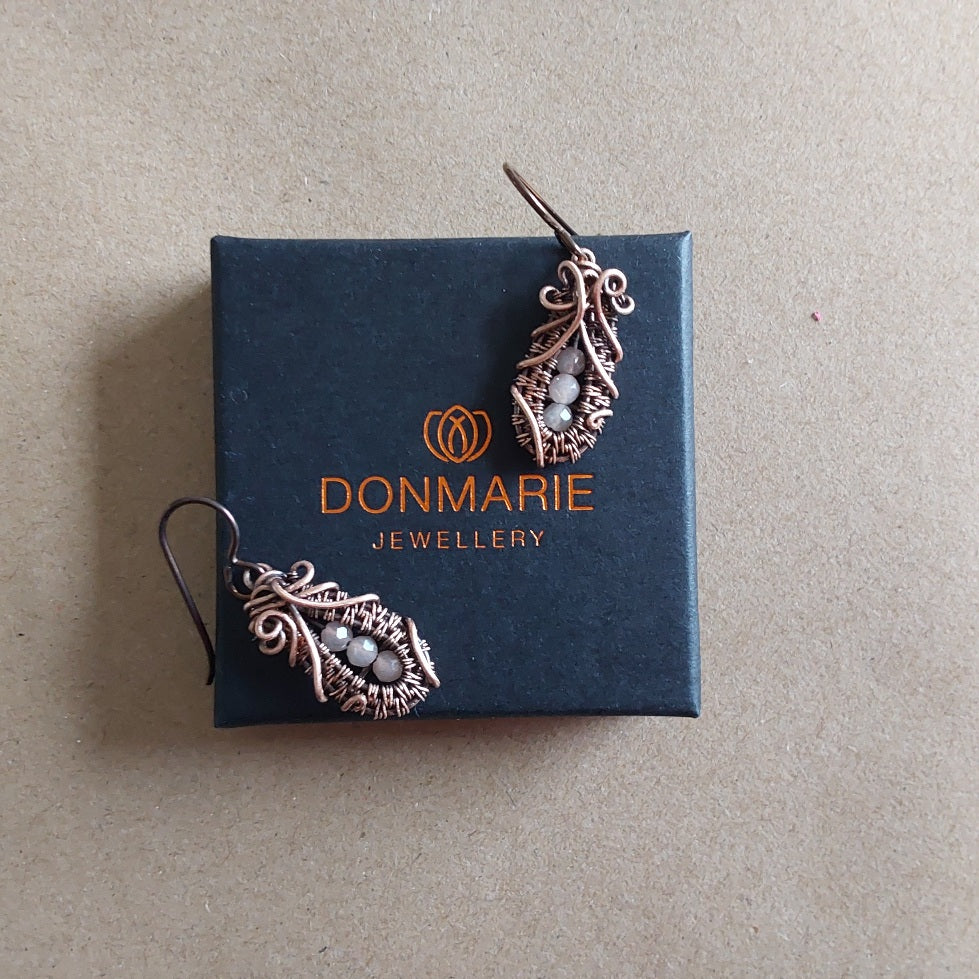 Faceted Peach Moonstone 'Ballet Shoe' style earrings with hypoallergenic ear wires. The wire weave component of each earring is approximately 1/2 an inch (2cm) in length plus ear wire length of 2 cm.