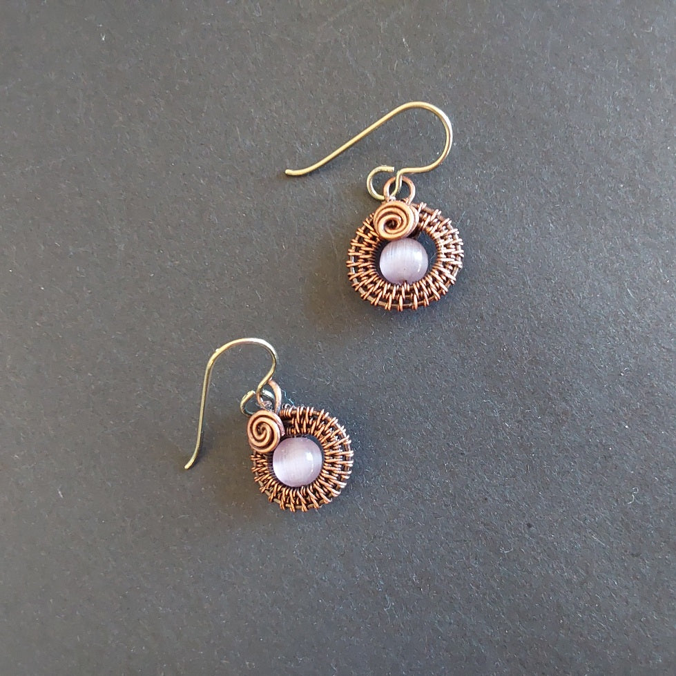 Mauve Cats Eye gemstone bead, copper wire weave non-tarnishing earrings with hypoallergenic ear wires. Earrings are 1/2 inch (1.5 cm) plus ear wire length of 2 cm.