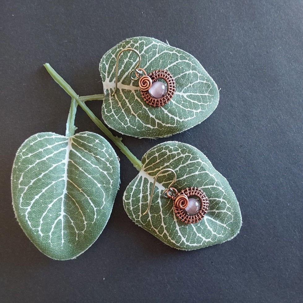 Mauve Cats Eye gemstone bead, copper wire weave non-tarnishing earrings with hypoallergenic ear wires. Earrings are 1/2 inch (1.5 cm) plus ear wire length of 2 cm.