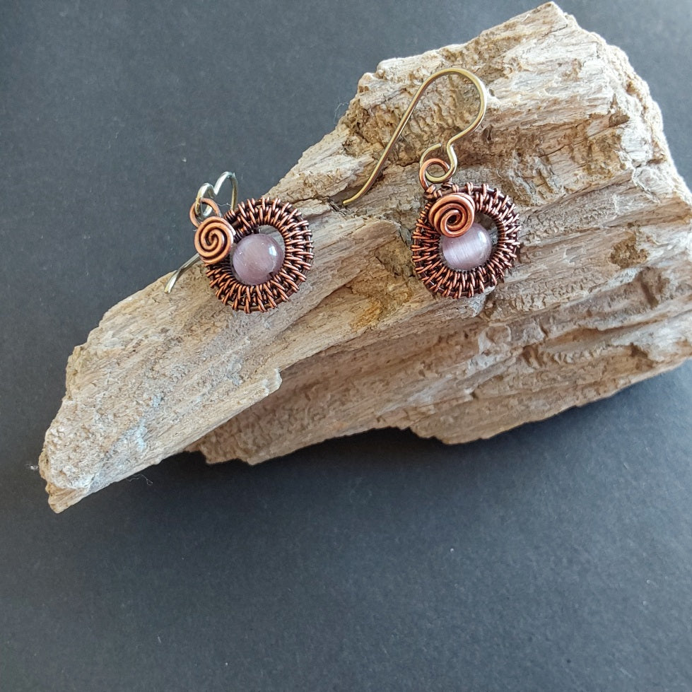 Mauve Cats Eye gemstone bead, copper wire weave non-tarnishing earrings with hypoallergenic ear wires. Earrings are 1/2 inch (1.5 cm) plus ear wire length of 2 cm.