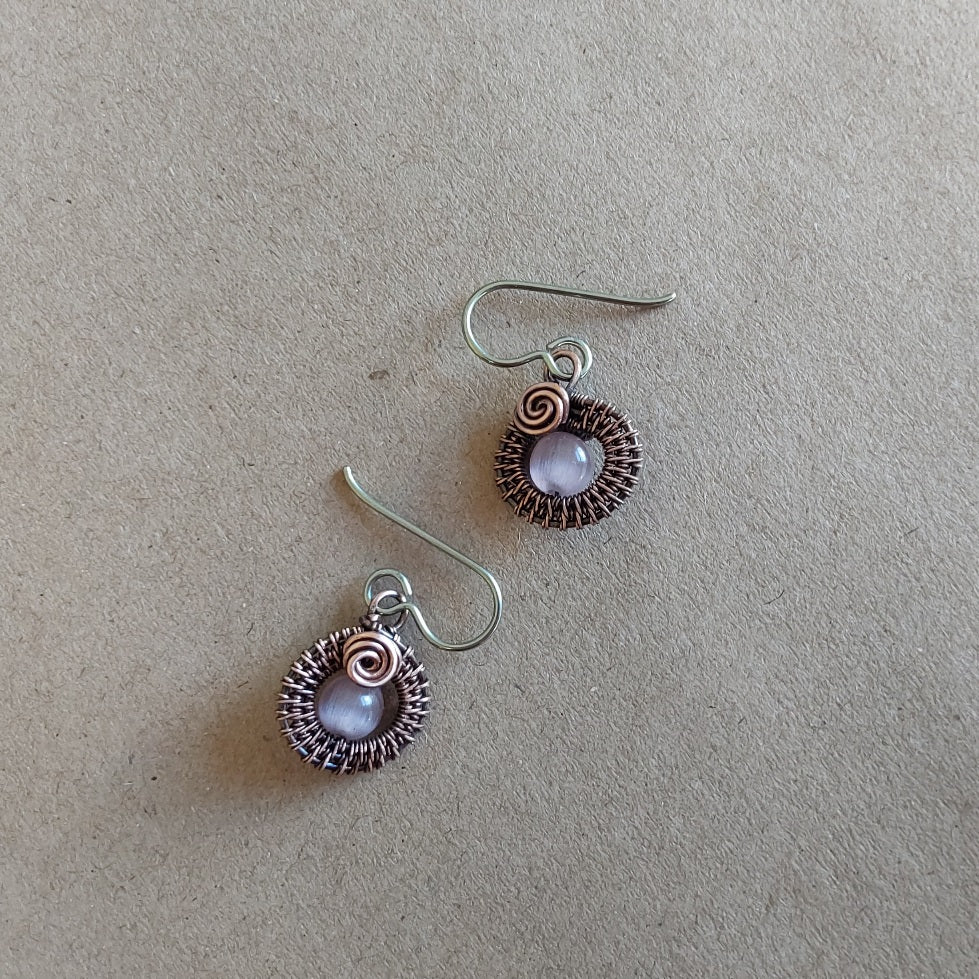 Mauve Cats Eye gemstone bead, copper wire weave non-tarnishing earrings with hypoallergenic ear wires. Earrings are 1/2 inch (1.5 cm) plus ear wire length of 2 cm.
