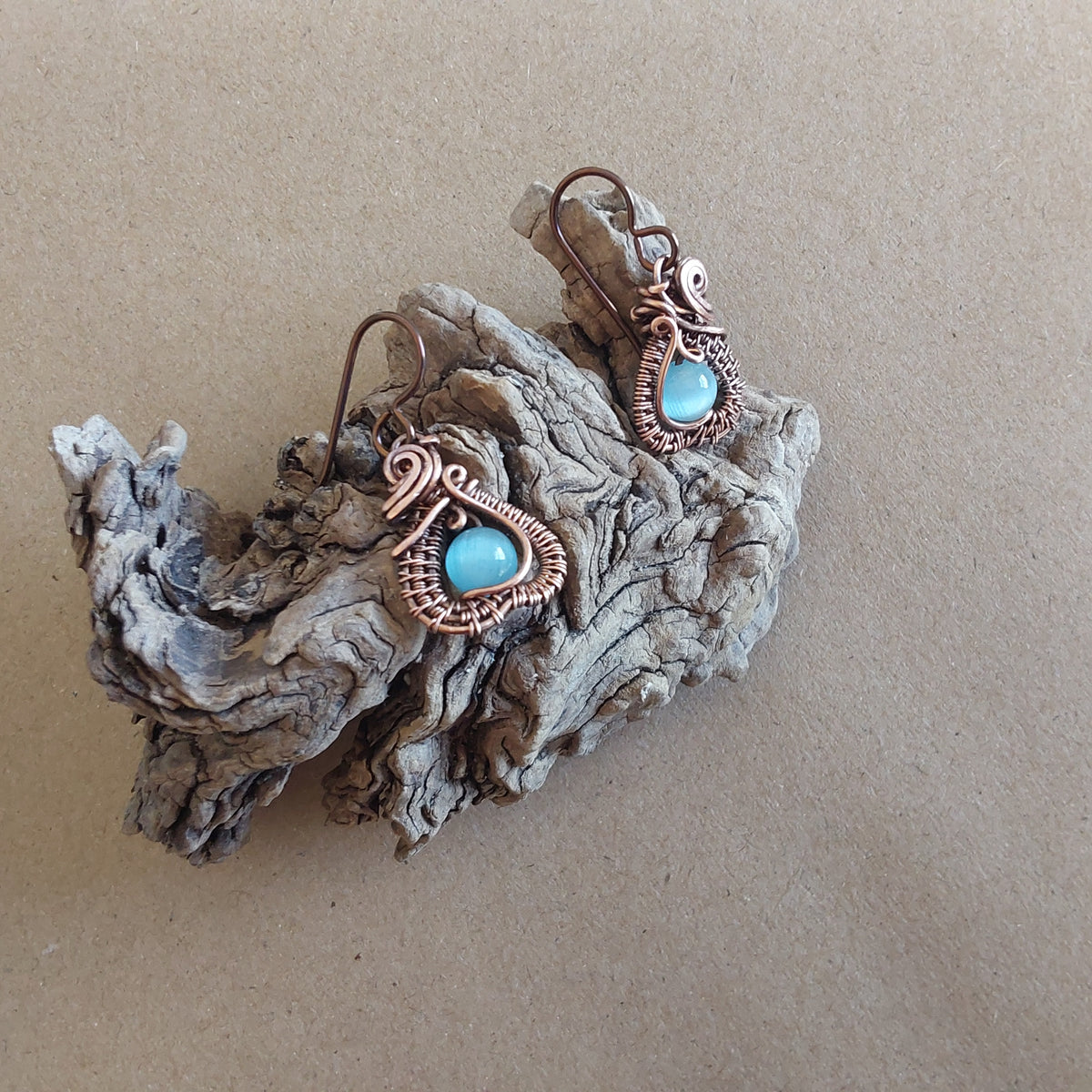 Intricate wire weave earrings with Blue Cats Eye beads