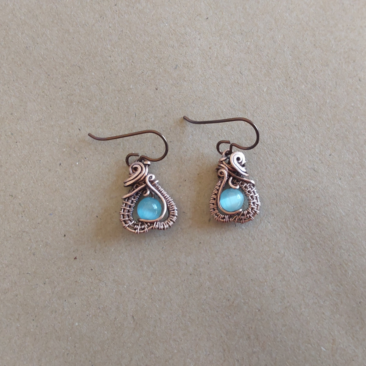 Intricate wire weave earrings with Blue Cats Eye beads
