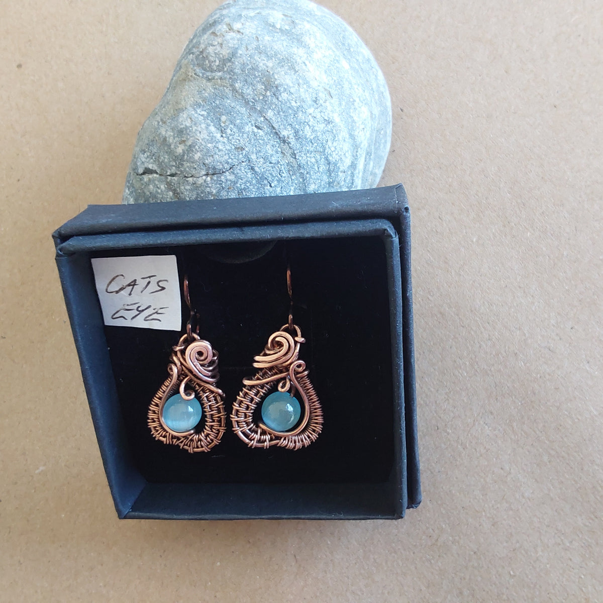 Intricate wire weave earrings with Blue Cats Eye beads