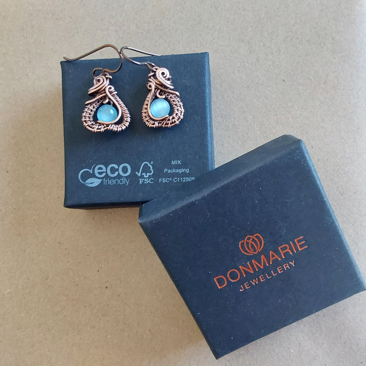 Intricate wire weave earrings with Blue Cats Eye beads