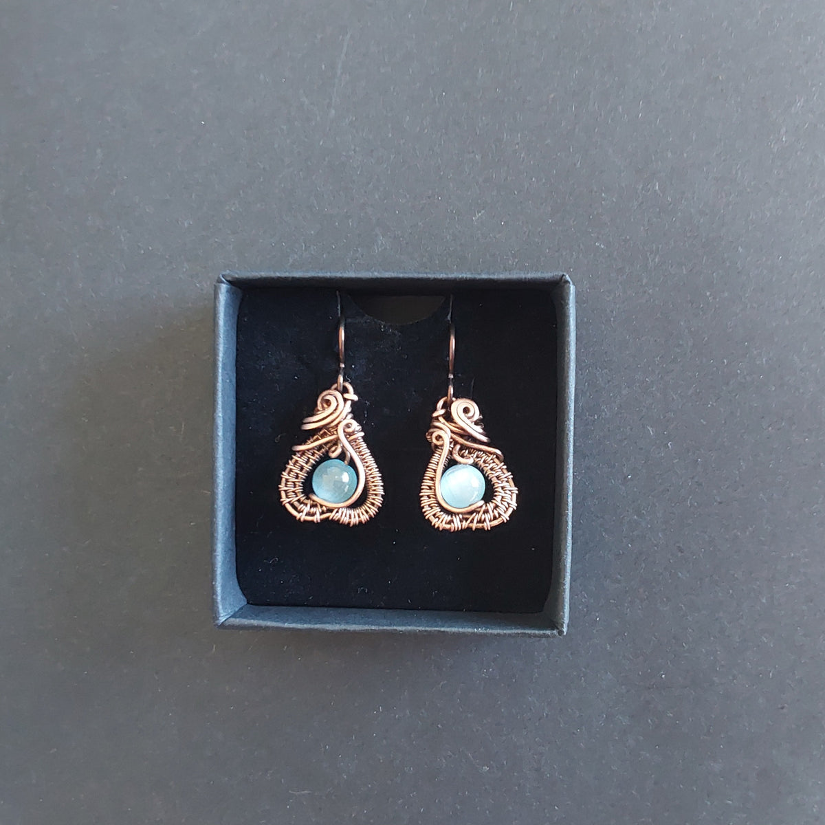 Intricate wire weave earrings with Blue Cats Eye beads